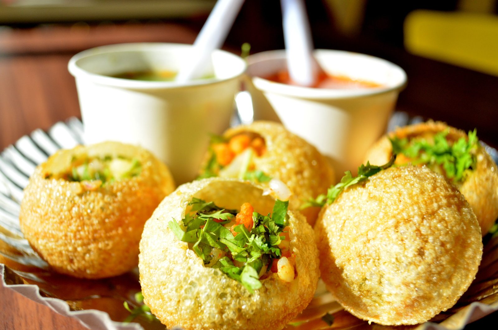 Golgappas being served with flavored water.