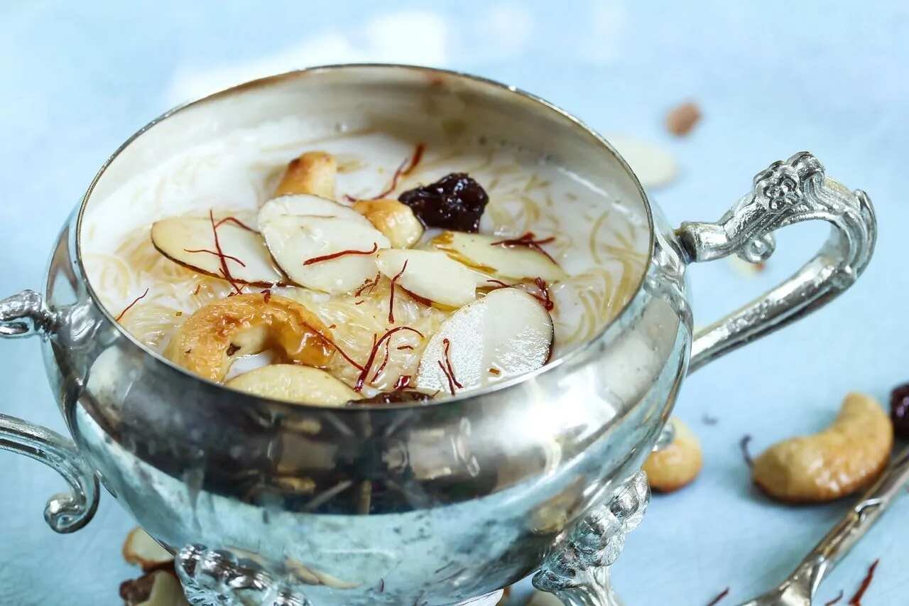 A bowl of Benami Kheer with saffron strands on top